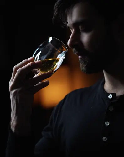 Man nosing whiskey from the Norlan Whisky Glass (Clear)