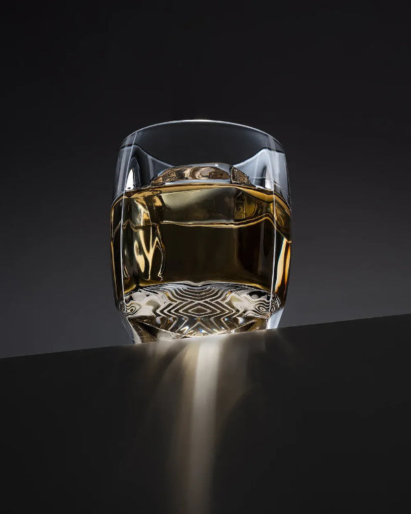 Sinder (grey) variant of the Rauk Heavy Tumbler on desktop layout, showcasing smoked tint and heavy base