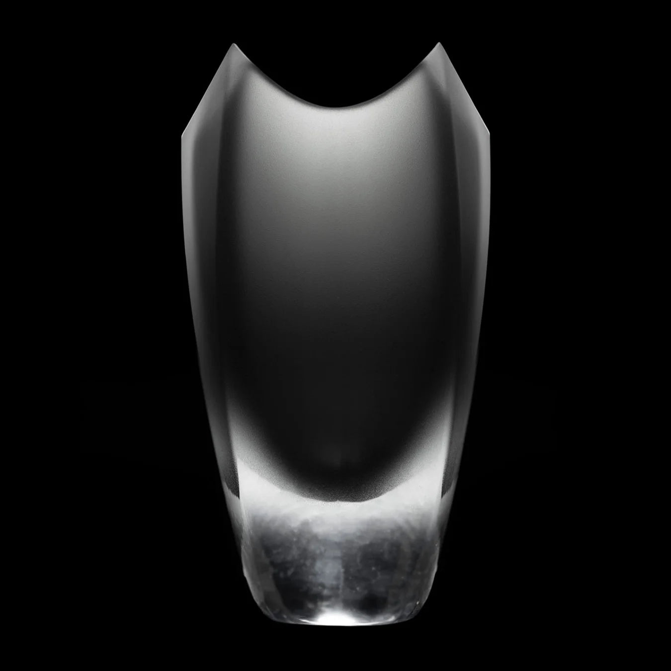 Side view of the Drave Water Carafe, a mouth-blown hand-cut vessel for use with the aluminum pipette