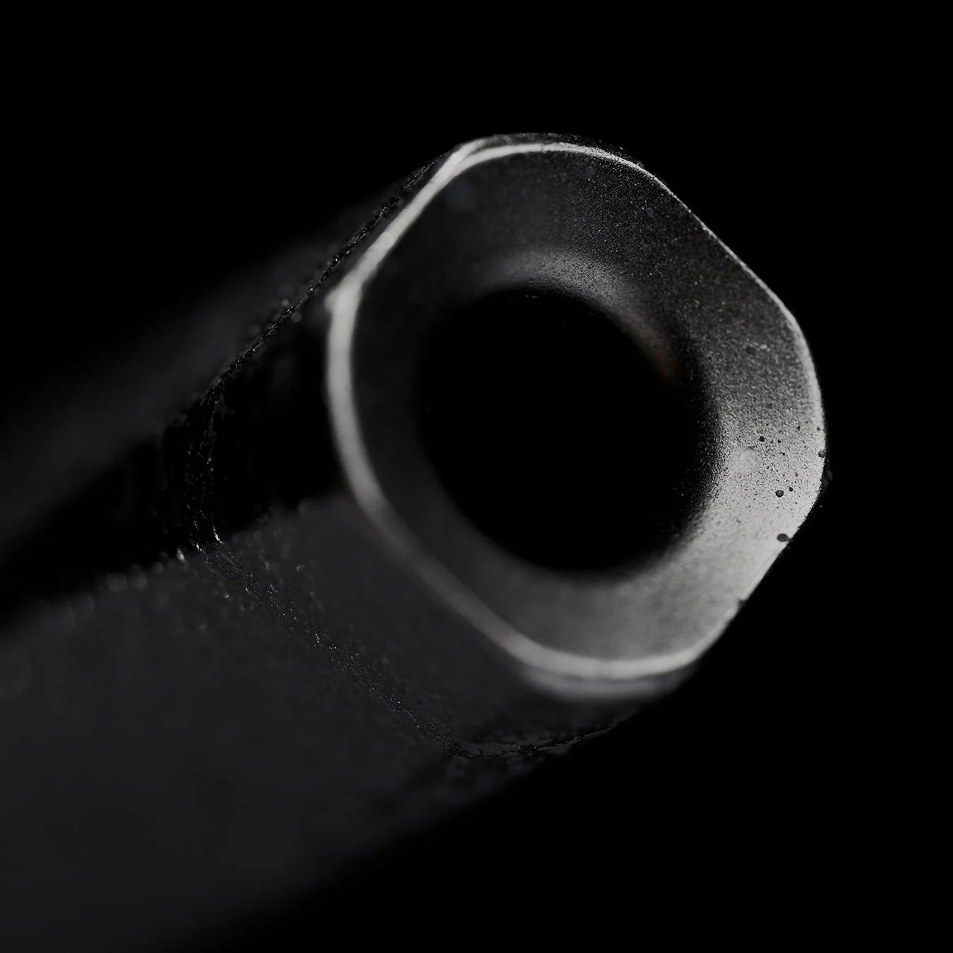 Close-up of aluminum pipette tip with rounded square shape, designed for adding water drops to whisky and spirits