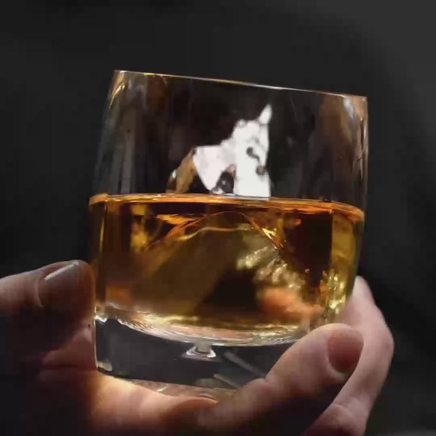 The Rauk Heavy Tumbler 250 mL (Clear) being held and rotated in one hand. 