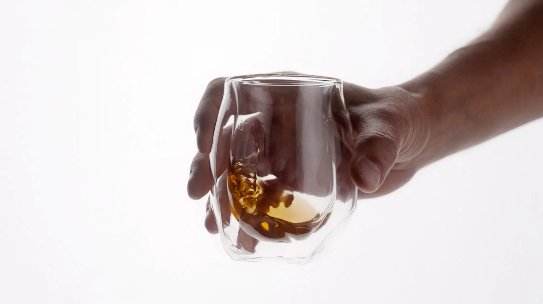 norlan whisky glass feature in clear and vaild-black highlighting the two different options of the glass against a stark white backdrop - one clear, one black. 