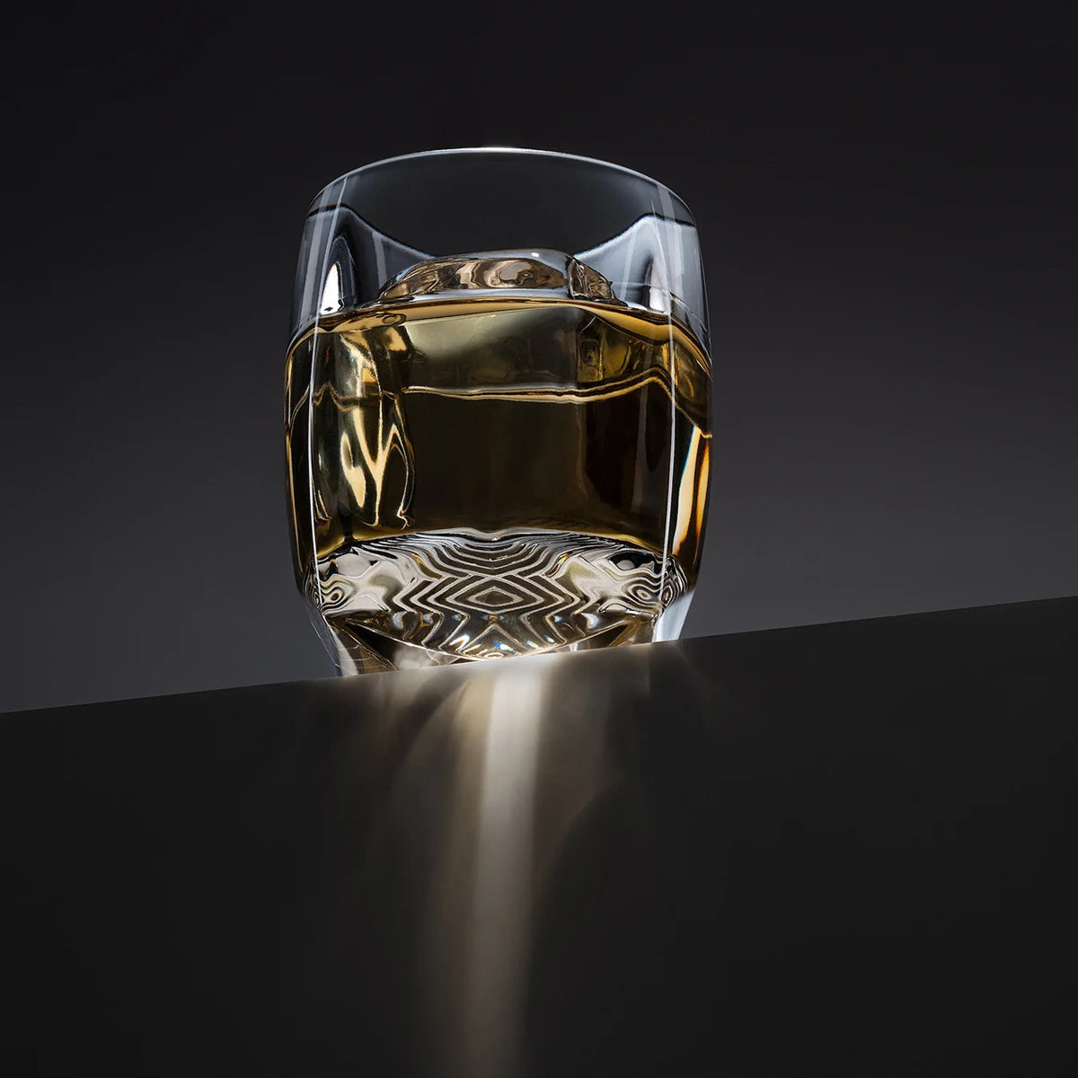 Sinder (grey) variant of the Rauk Heavy Tumbler on desktop layout, showcasing smoked tint and heavy base