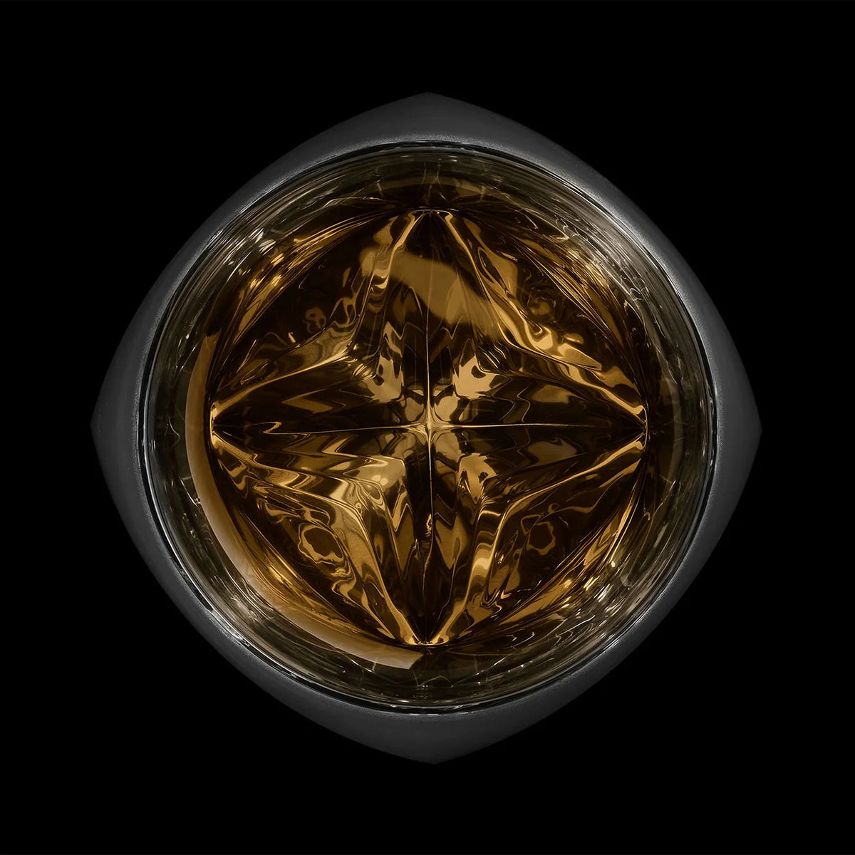 Matte black Rauk Heavy Tumbler with a reflective mirrored interior, perfect for showcasing whiskey and spirits in a striking design