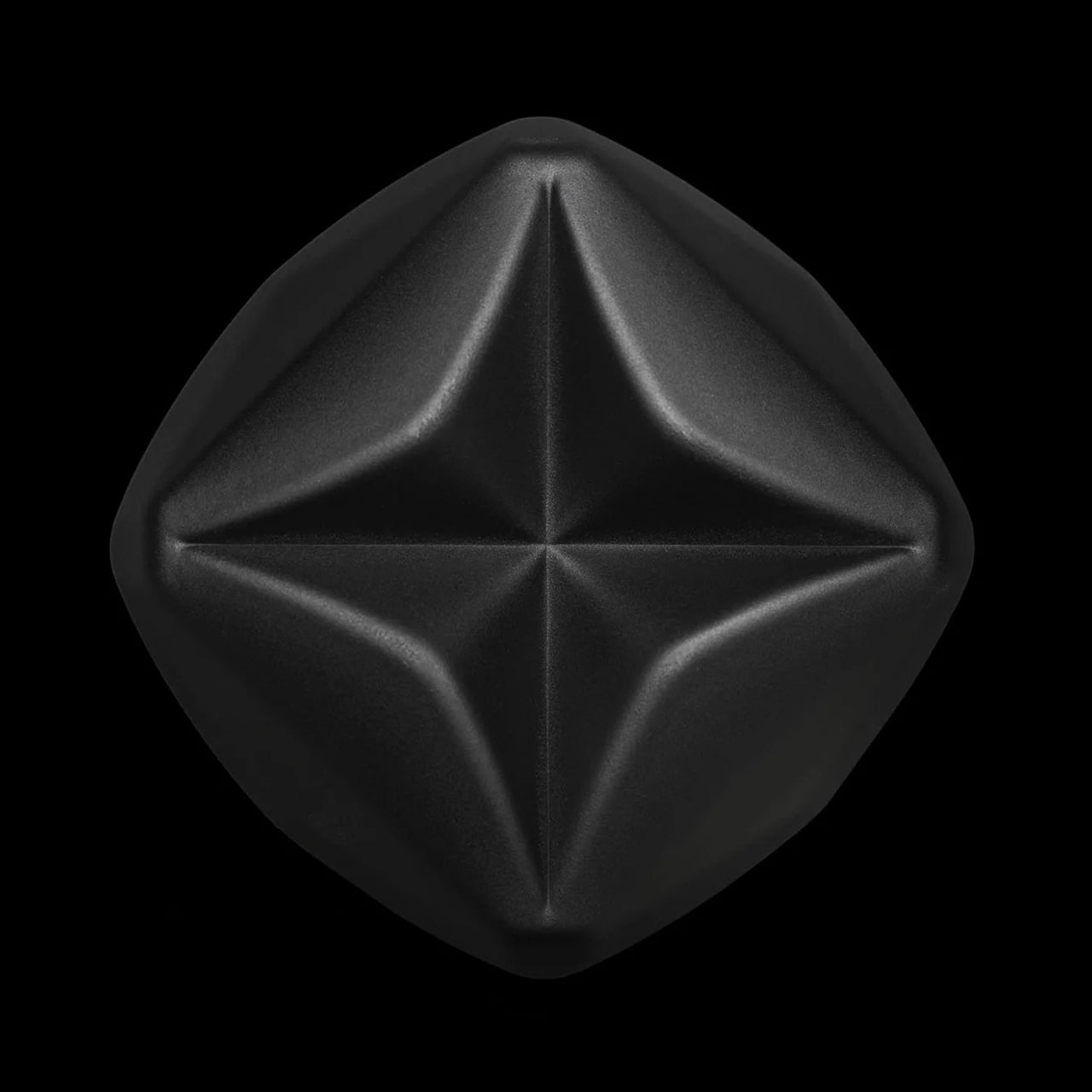 Detail of the whisky tumbler's star-shaped base in matte black lacquered non-leaded crystal
