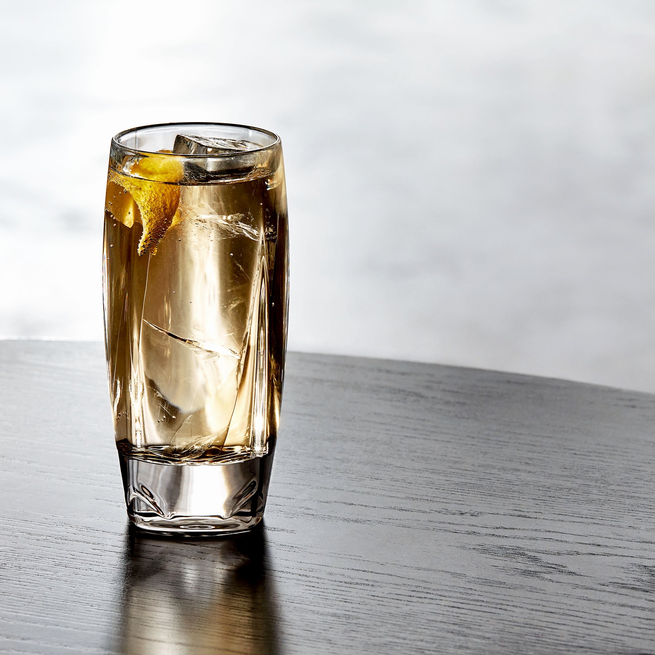 A whiskey soda served in a highball glass